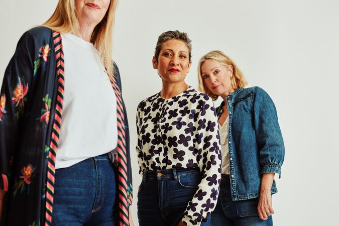 Three stylish older women in studio portrait