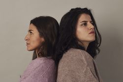 Confident female friends in studio