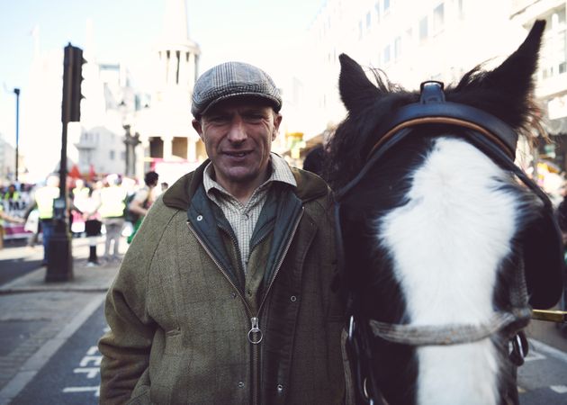 London, England, United Kingdom - March 19 2022: Man in tweed hat with pony