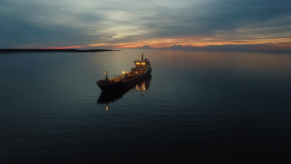 Aerial Shot of Tanker Ship Moving in Sea at Night