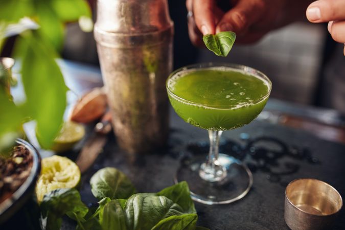Topping cocktail with Basil leaf