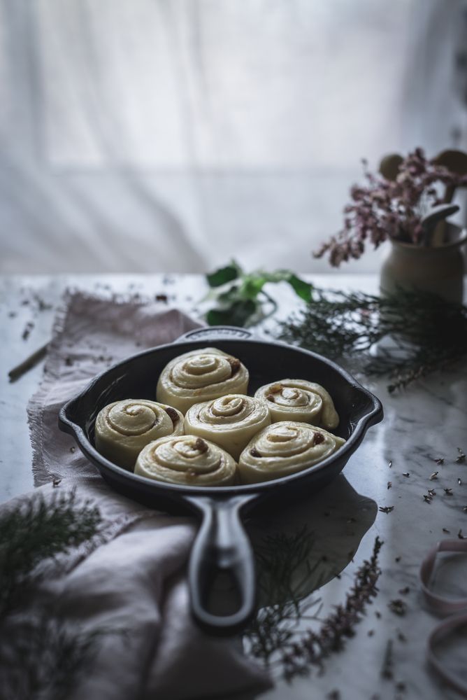 Fresh cinnamon rolls on table
