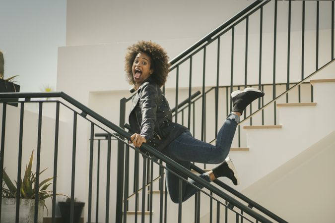 Black woman having fun on steps