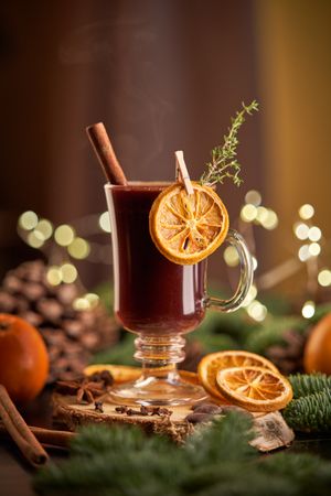 Mulled wine on table with coniferous branches
