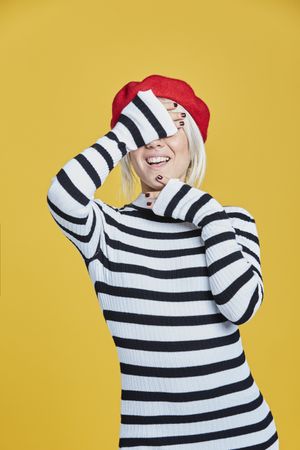 Happy young female in red beret