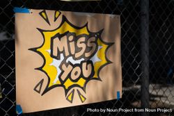 Close up shot of handmade sign with the words “Miss you” 4Od87b