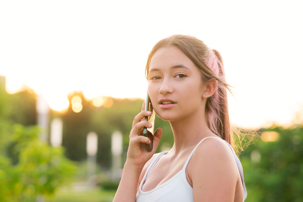 Teen girl using smartphone