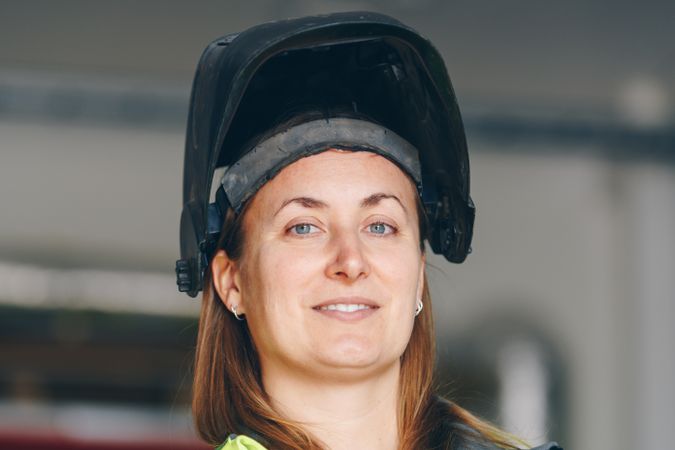 Woman wearing welding mask