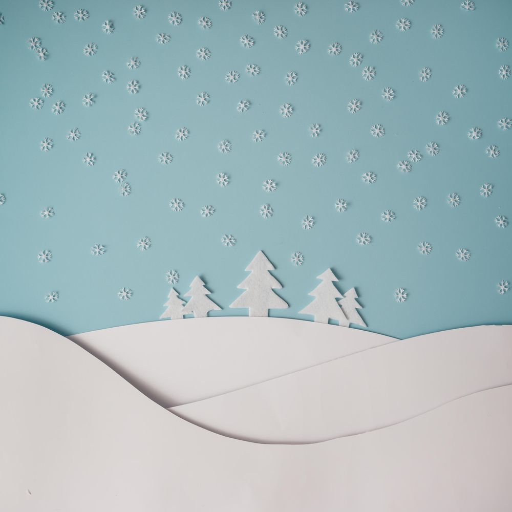 Christmas winter landscape with snowy hills and trees