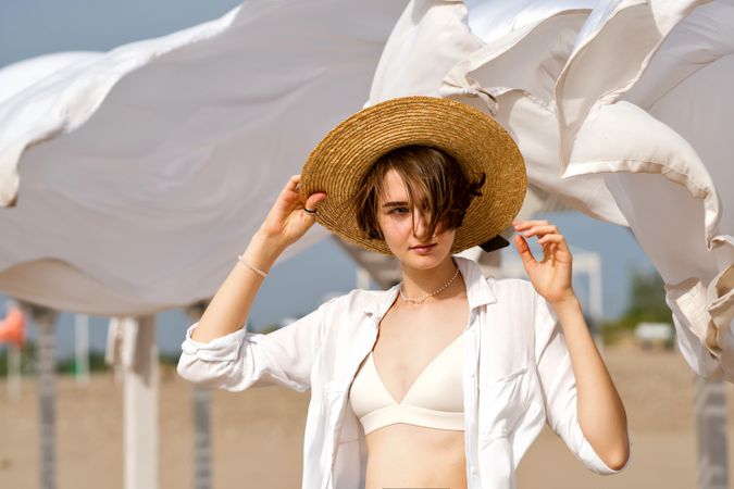 Woman on beach on windy day