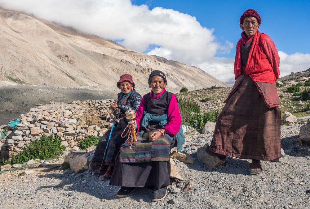 Tibet - August, 29 2014: Tibetan men and women in mountainous region