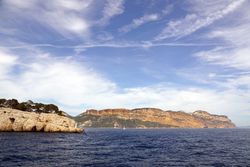 sailboat in sea and beautiful rocks