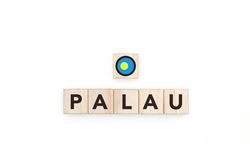 Wooden blocks bearing the name and flag of Palau.