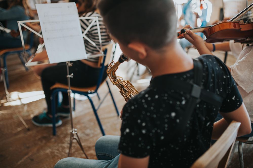 Students playing musical instruments in band class