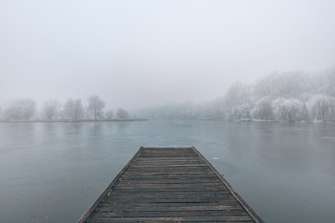 Dock of a lake on a wintry day