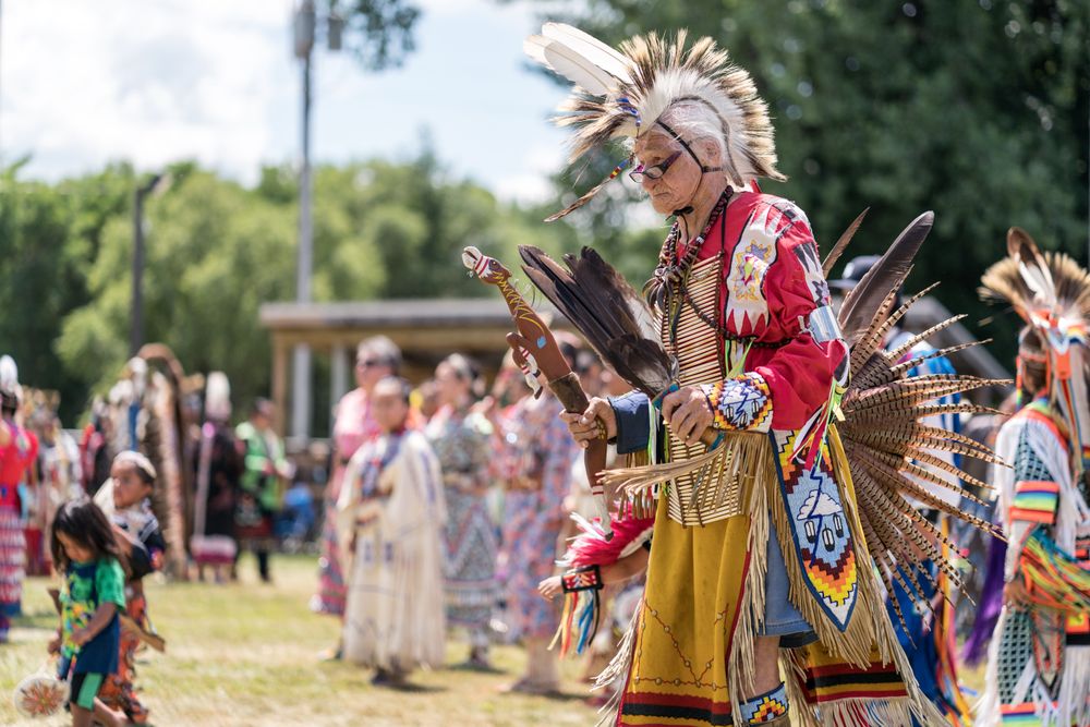 Red Wing, MN, USA - July 8th, 2017: Mature Sioux man in traditional feathered regalia