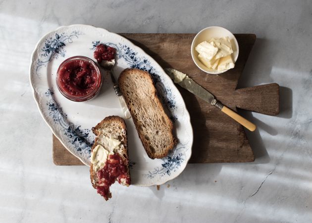 Served breakfast meal with sandwich and jam