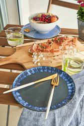Breakfast table with ham toasts and oatmeal bowl with berries