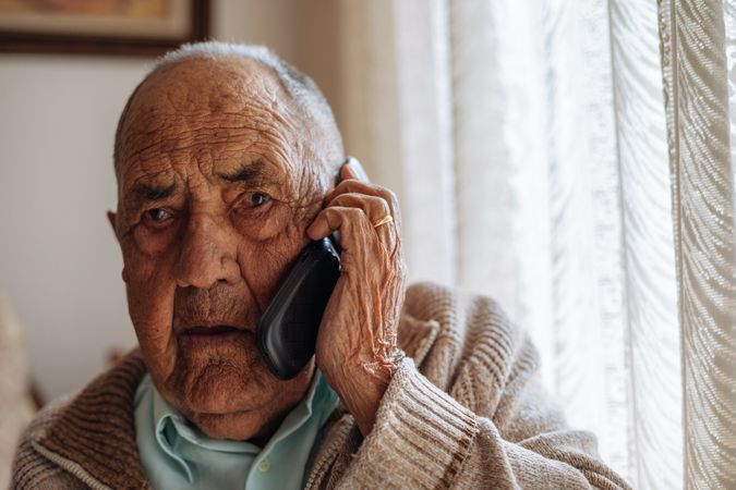 Older man calling from his phone