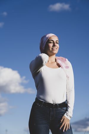 Young woman with hair in cancer wrap