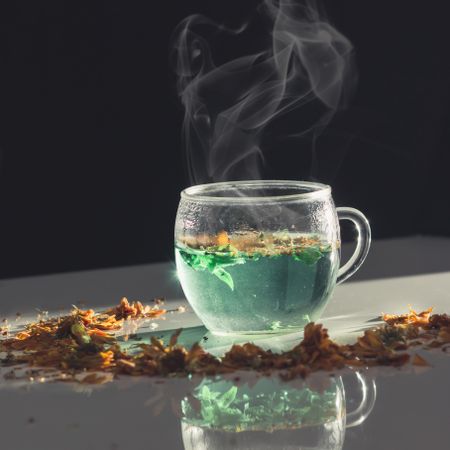 Hot herbal tea in glass cup