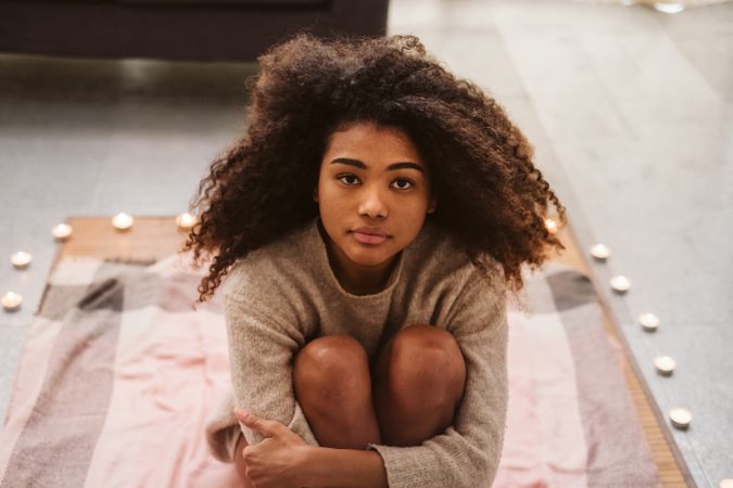 Black woman sitting on floor