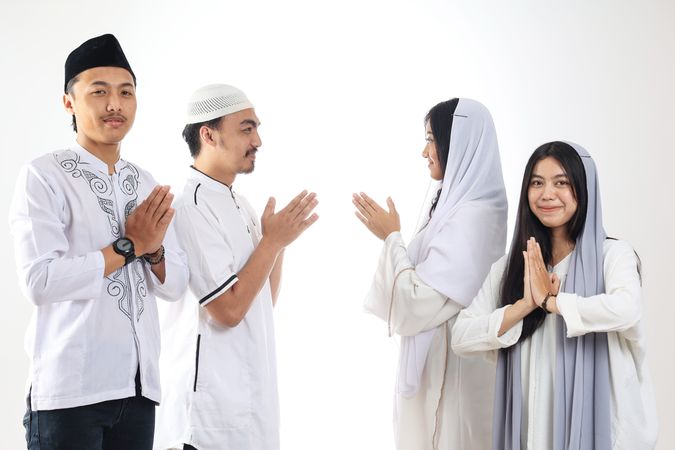Asian People Friends Forgiving Each Other during Eid Mubarak Celebration