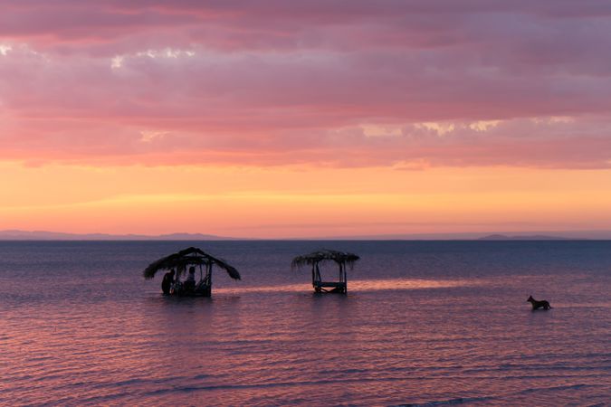 Laundry in sea at sunset