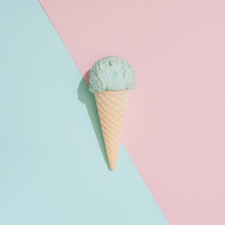 Ice cream on pastel pink and blue background