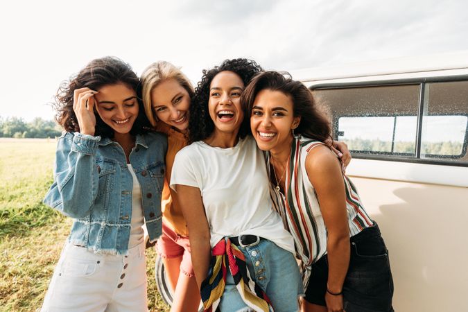 Group of smiling women together in a field