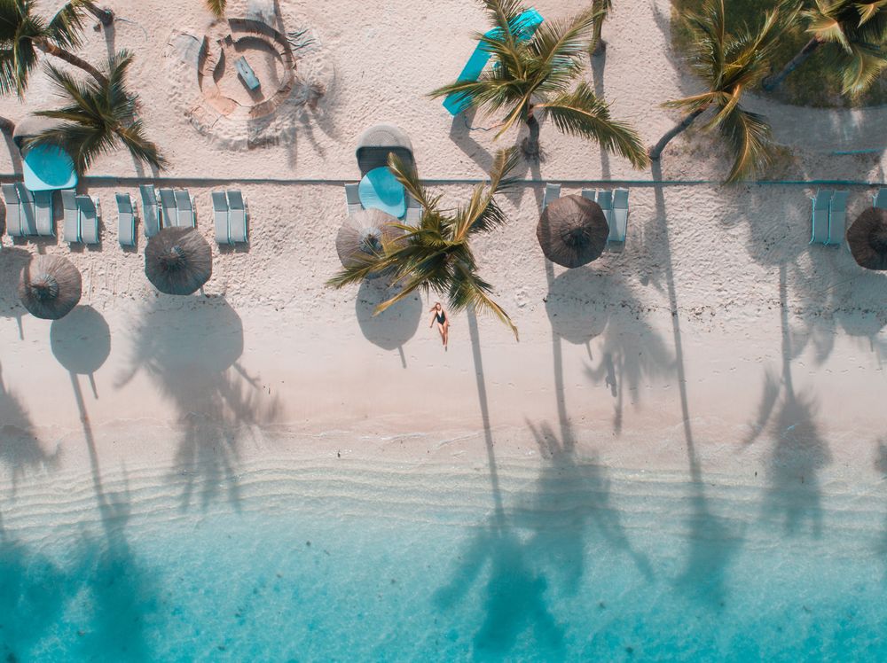 Aerial view of woman lying on beach