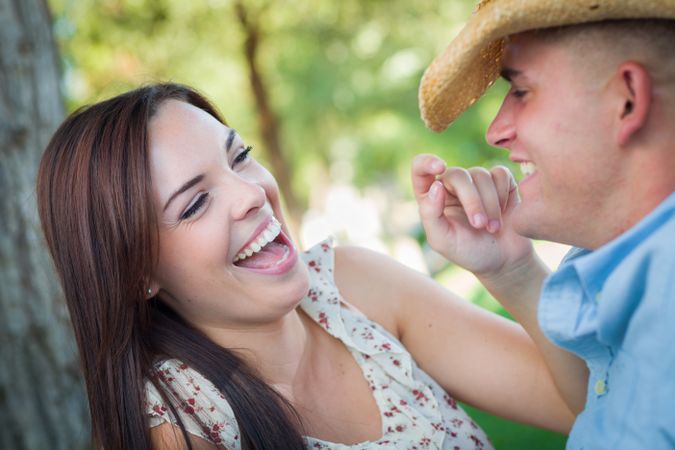 Playful Couple Talking in the Park.