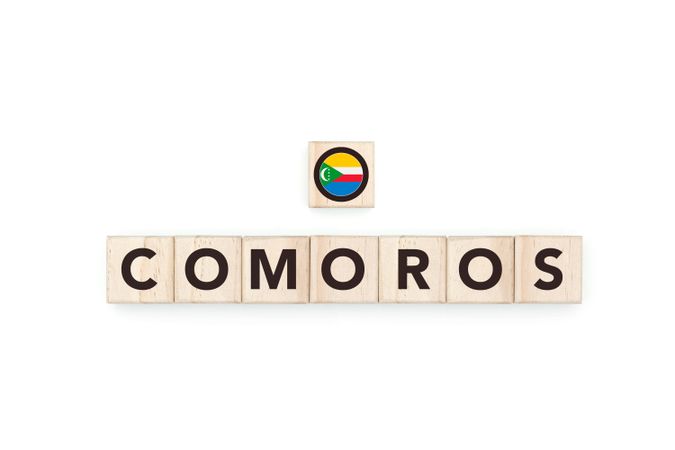 Wooden blocks bearing the name and flag of Comoros.
