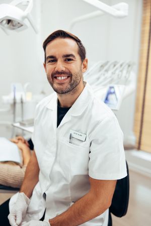 Portrait of confident dental expert in his clinic