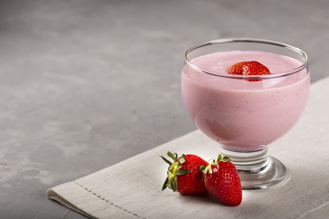 Delicious strawberry mousse in glass goblet.
