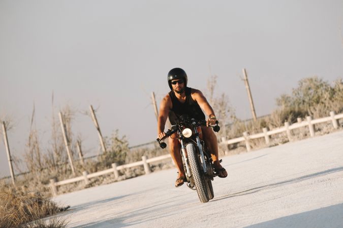Confident male driving motorcycle