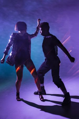 young dancers near smoke