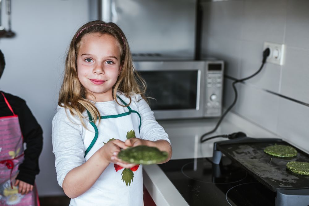 Smiling girl with vegan cutlets
