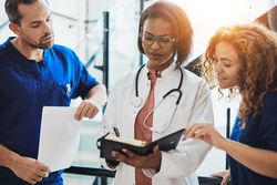Group of medical staff analyzing a medical chart
