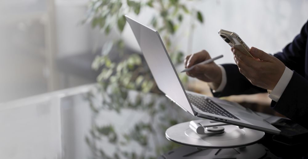 Businessman Working on Laptop at Office Desk
