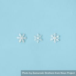 Row of snowflakes on blue background 0gmOA4