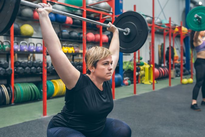 Woman practicing weightlifting in the gym