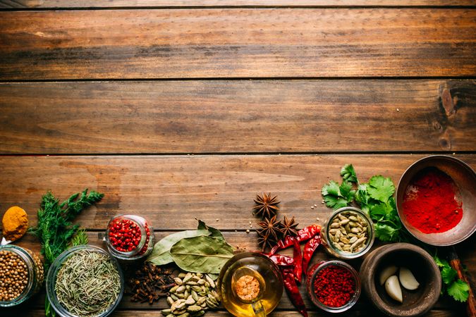 Spices and oil on table