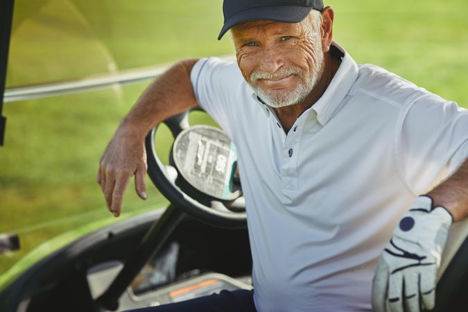 Man sitting in golf cart