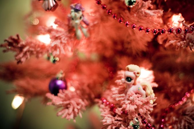 Cute festive pastel pink tree with vintage ornaments