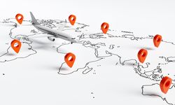 Wide shot of airplane model going over drawn map with location markers