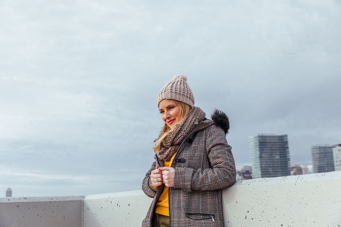 Portrait of blonde woman posing in the city