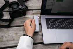 Man transferring data on laptop