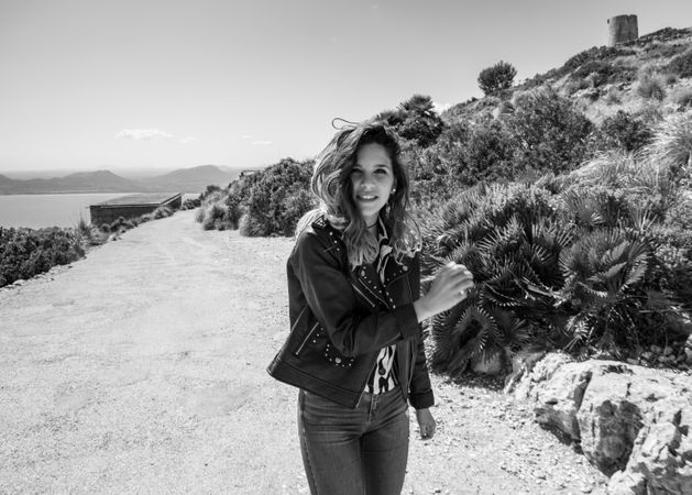 Smiling female on seashore