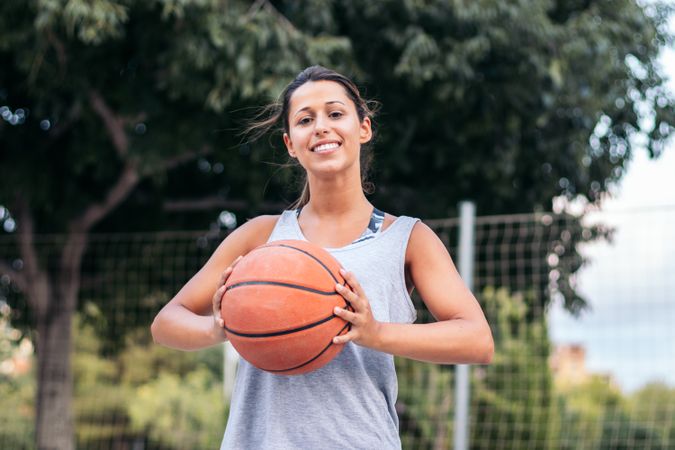 Portrait of Female Basketball Player Holding Ball